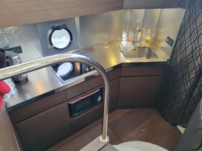 Fantasia 04 Yacht Photos Pics 2009 Azimut 43S yacht kitchen with modern appliances and sleek design.