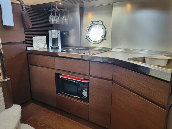 Fantasia 04 Yacht Photos Pics Luxurious kitchen interior of 2009 Azimut 43S yacht with modern amenities.