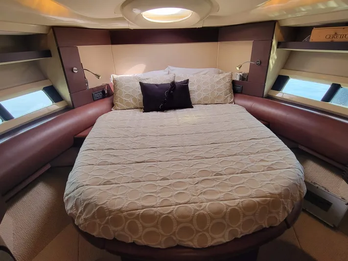 Fantasia 04 Yacht Photos Pics Luxurious bedroom interior of 2009 Azimut 43S yacht with circular bed and modern design.