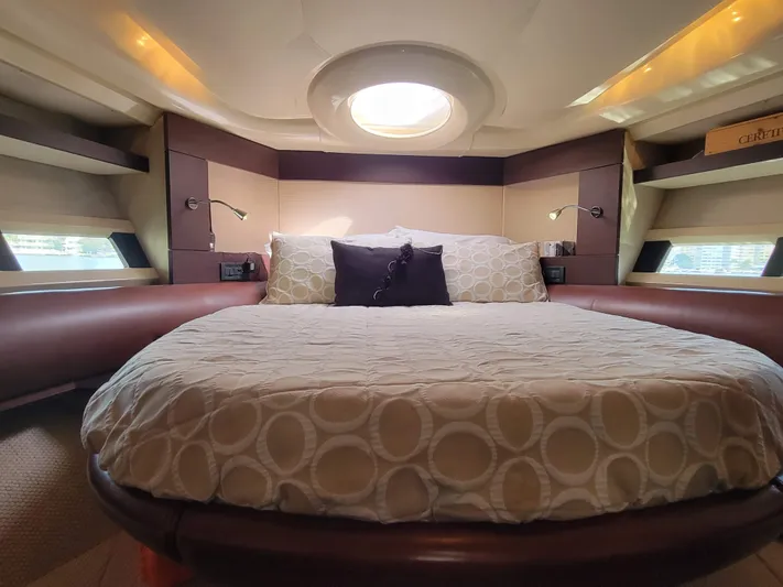 Fantasia 04 Yacht Photos Pics Luxurious bedroom interior of 2009 Azimut 43S yacht with circular bed and modern design.