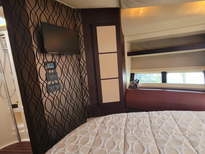 Fantasia 04 Yacht Photos Pics Luxurious interior of 2009 Azimut 43S yacht with modern decor and wall-mounted TV.