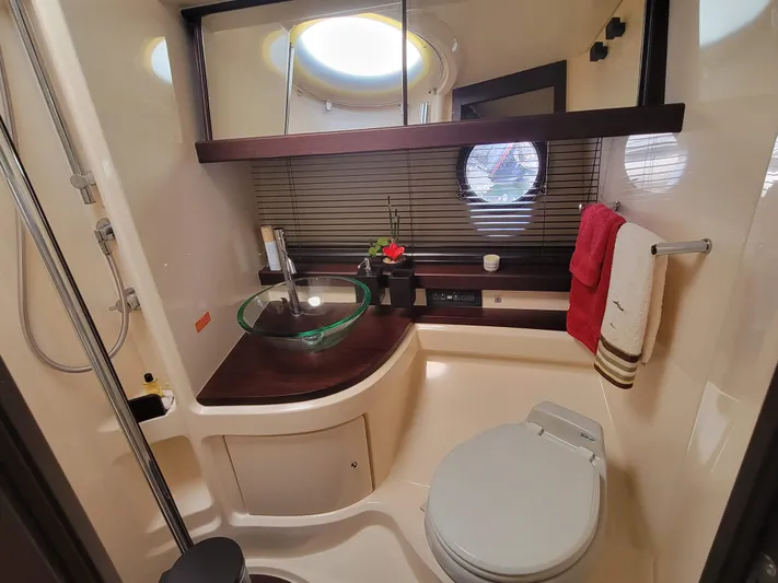 Fantasia 04 Yacht Photos Pics Luxurious bathroom in 2009 Azimut 43S yacht with modern fixtures and elegant design.