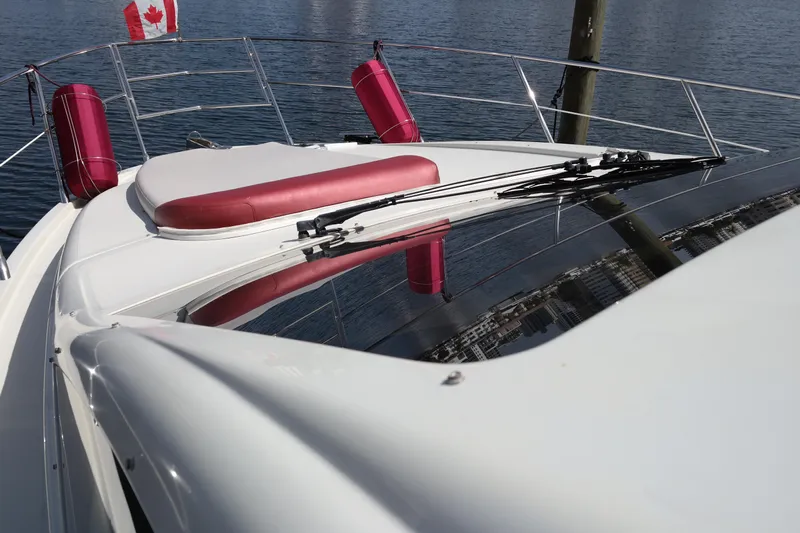 Fantasia 04 Yacht Photos Pics 2009 Azimut 43S yacht deck with Canadian flag and red cushions.