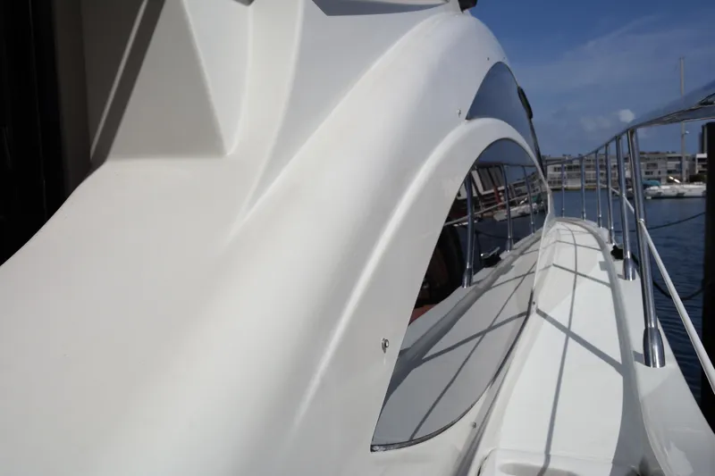 Fantasia 04 Yacht Photos Pics 2009 Azimut 43S yacht side view with sleek design and marina background.