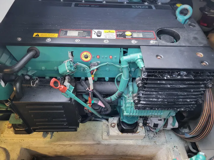 Fantasia 04 Yacht Photos Pics Engine compartment of a 2009 Azimut 43S yacht, showcasing mechanical components.