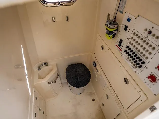  Yacht Photos Pics Interior of 2010 Edgewater 318CC boat featuring control panel and compact sink.