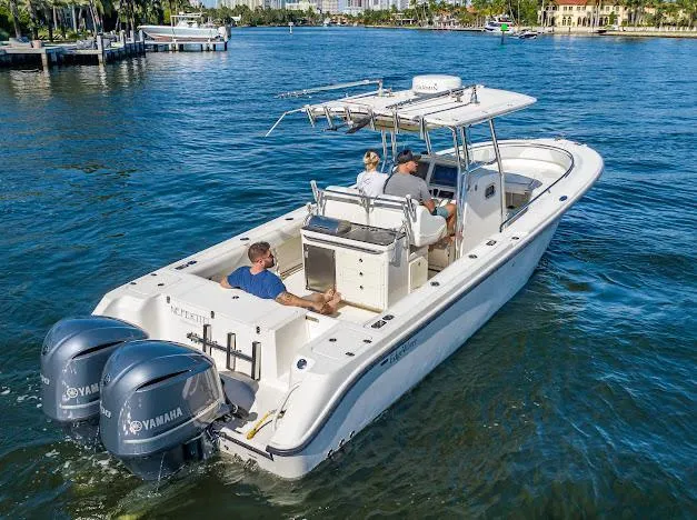  Yacht Photos Pics 2010 Edgewater 318CC boat cruising on a sunny day with Yamaha engines.