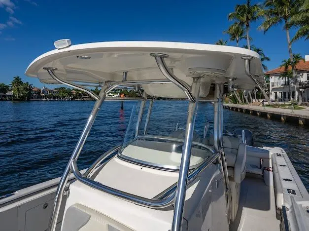  Yacht Photos Pics Edgewater 318CC 2010 boat on water, featuring sleek design and sturdy T-top.