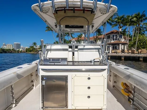  Yacht Photos Pics Edgewater 318CC boat interior with console, drawers, and scenic waterfront view.