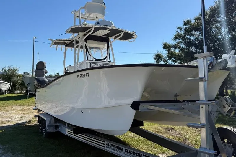  Yacht Photos Pics Calcutta 263 boat on trailer, 2015 model, parked outdoors under clear sky.