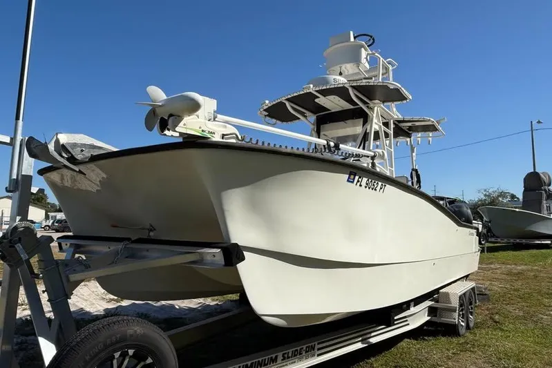  Yacht Photos Pics 2015 Calcutta 263 boat on trailer under clear blue sky.