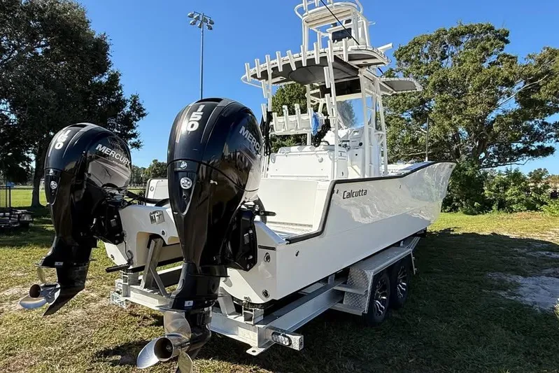  Yacht Photos Pics Calcutta 263 boat with dual Mercury 150 engines, parked on a trailer, 2015 model.