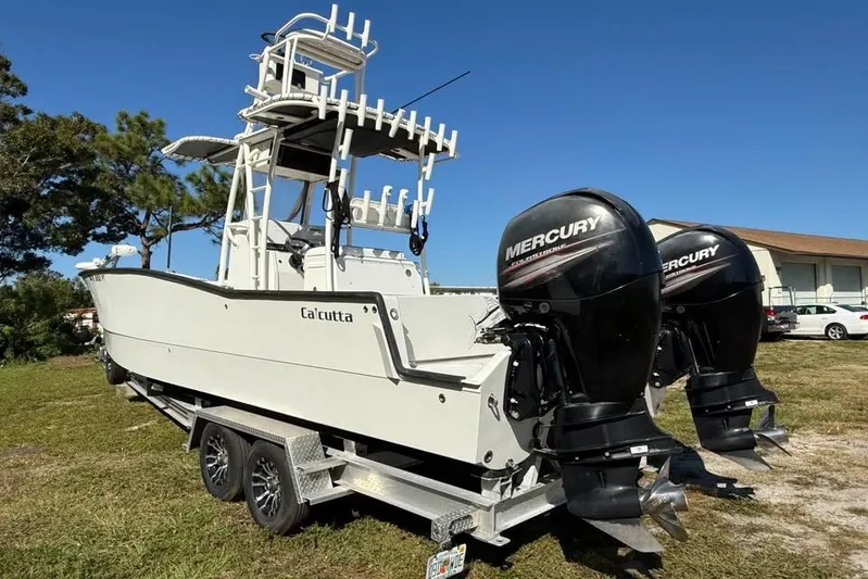  Yacht Photos Pics 2015 Calcutta 263 boat with dual Mercury engines on a trailer.