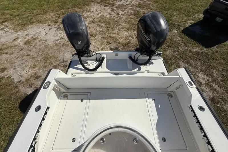  Yacht Photos Pics Calcutta 263 boat with dual outboard motors, parked on grass, 2015 model.