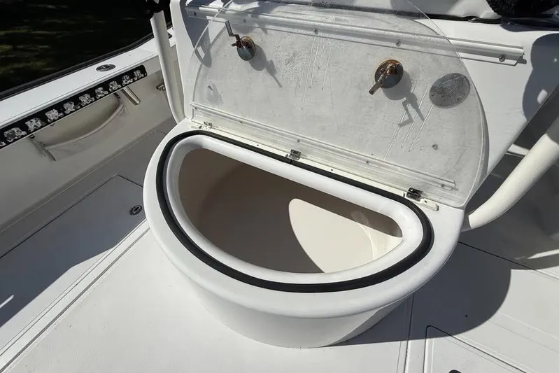  Yacht Photos Pics Open storage compartment on a 2015 Calcutta 263 boat deck.