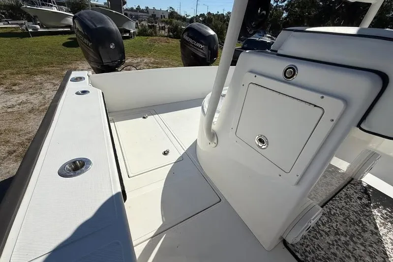  Yacht Photos Pics 2015 Calcutta 263 boat deck with dual Mercury outboard engines, white interior.