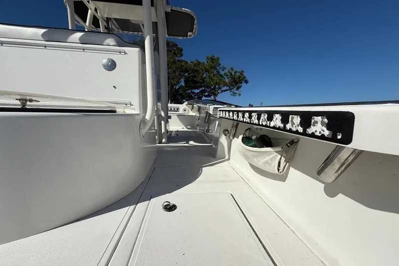  Yacht Photos Pics 2015 Calcutta 263 boat deck with storage compartments and clear blue sky.