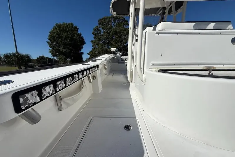 Yacht Photos Pics 2015 Calcutta 263 boat deck, white interior, clear sky, trees in background.