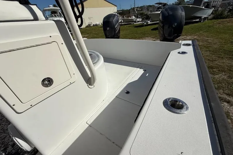  Yacht Photos Pics 2015 Calcutta 263 boat interior with storage compartment and dual outboard motors.