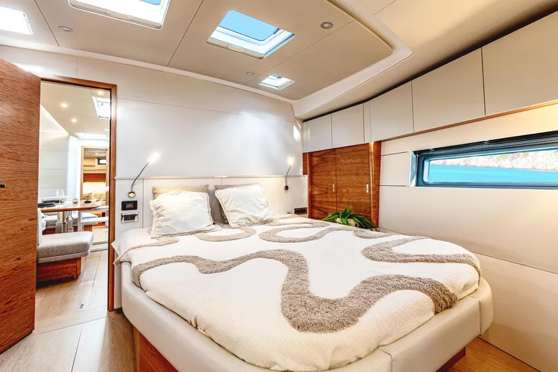  Yacht Photos Pics Luxurious interior of 2026 Hanse 590 yacht with modern bedroom design.