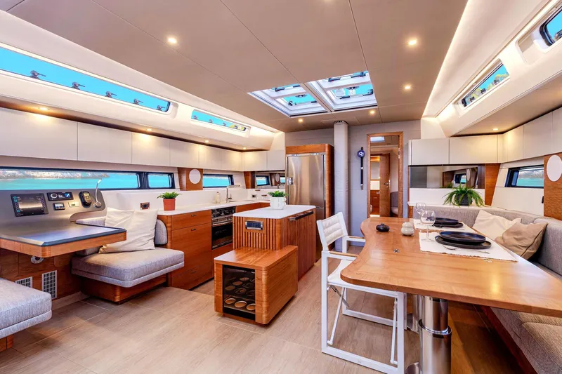  Yacht Photos Pics Luxurious interior of 2026 Hanse 590 yacht with modern kitchen and dining area.