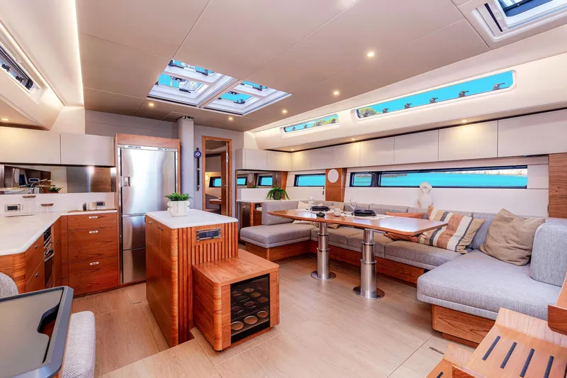  Yacht Photos Pics Luxurious interior of 2026 Hanse 590 yacht with modern kitchen and spacious seating area.