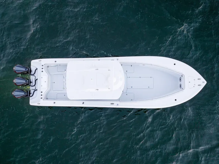 Yacht Photos Pics Aerial view of 2023 Yellowfin 34 boat on open water.