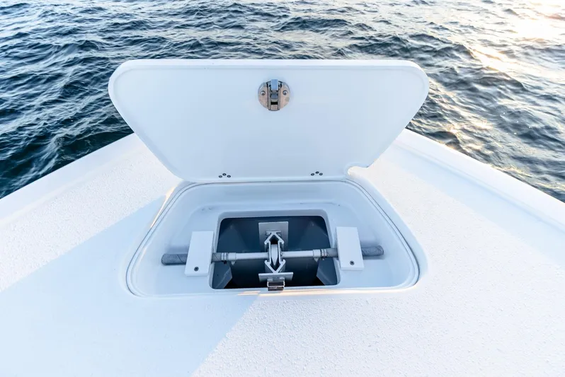  Yacht Photos Pics Open anchor compartment on 2023 Yellowfin 34 boat, with ocean background.