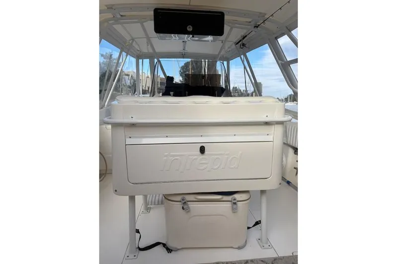 Mac & Seas Yacht Photos Pics 2000 Intrepid 356 Cuddy boat interior with helm station and seating area.