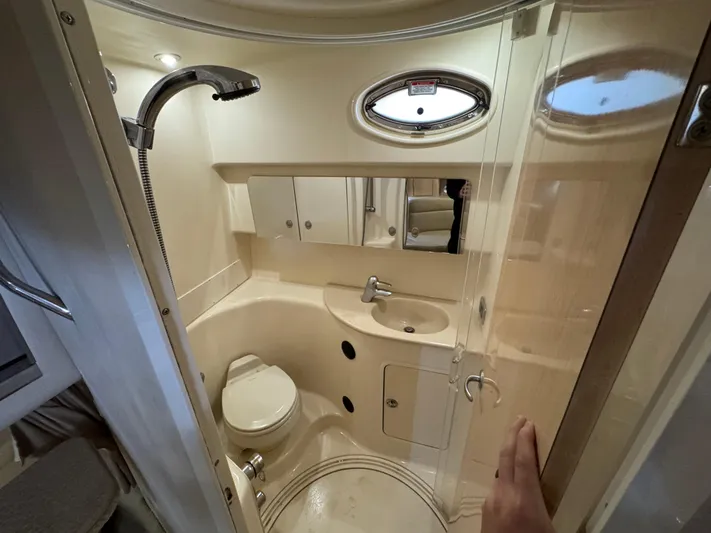  Yacht Photos Pics Bathroom interior of 2004 Sea Ray 360 Sundancer yacht, featuring shower, sink, and toilet.