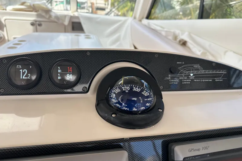 2009 Riviera 47 Yacht Photos Pics Dashboard of 2009 Riviera 47 Enclosed Flybridge Series II with compass and gauges.