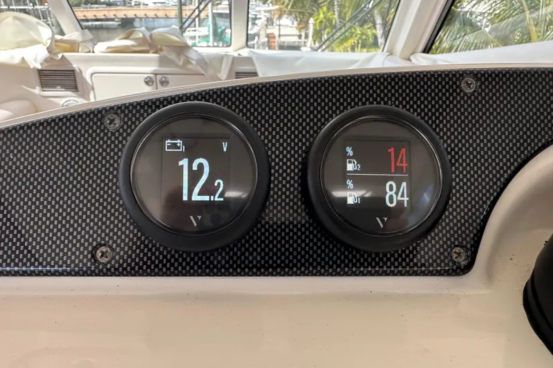 2009 Riviera 47 Yacht Photos Pics Dashboard of 2009 Riviera 47 Enclosed Flybridge Series II with voltage and fuel gauges.