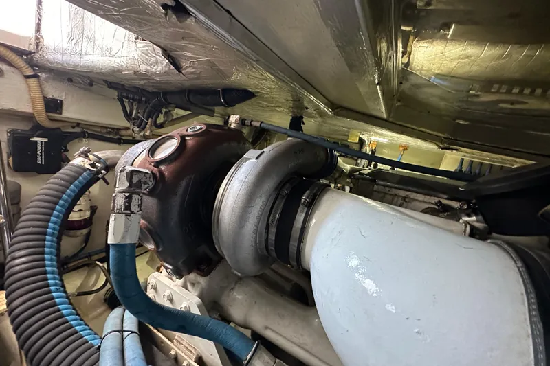 2009 Riviera 47 Yacht Photos Pics Engine room of 2009 Riviera 47 Enclosed Flybridge Series II with visible components and hoses.