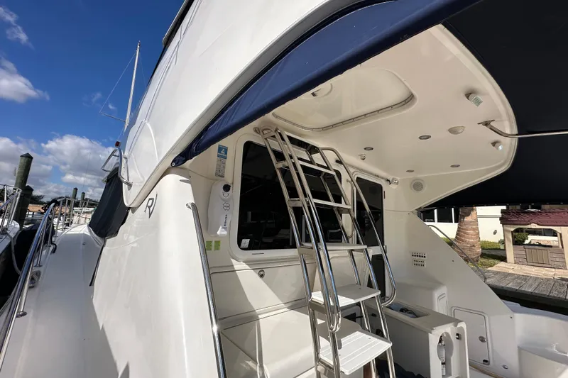 2009 Riviera 47 Yacht Photos Pics 2009 Riviera 47 Enclosed Flybridge Series II yacht with ladder and sleek design.