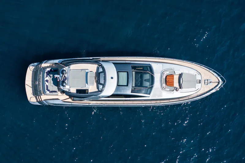 Silver Breeze Yacht Photos Pics Aerial view of 2010 Riva Domino 86 yacht on deep blue water.