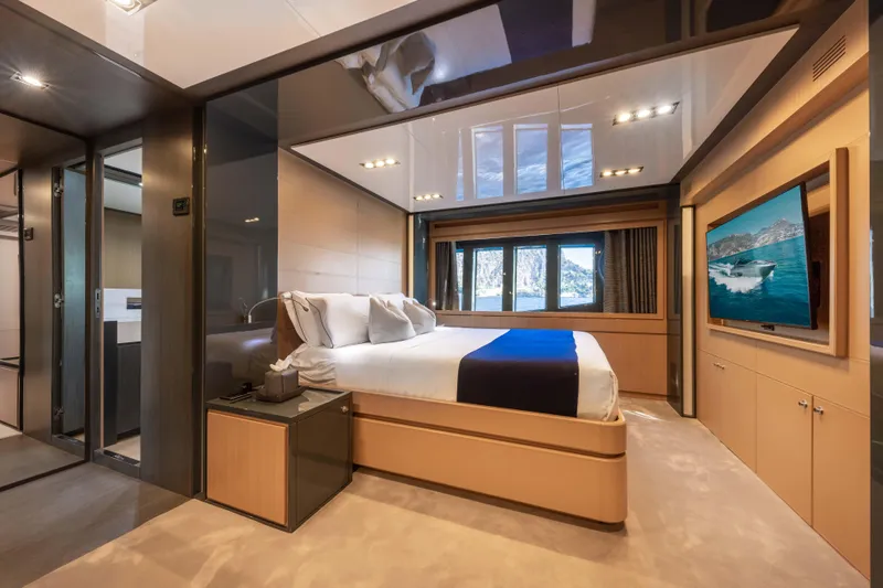 Silver Breeze Yacht Photos Pics Luxurious bedroom interior of 2010 Riva Domino 86 yacht with modern design and large windows.