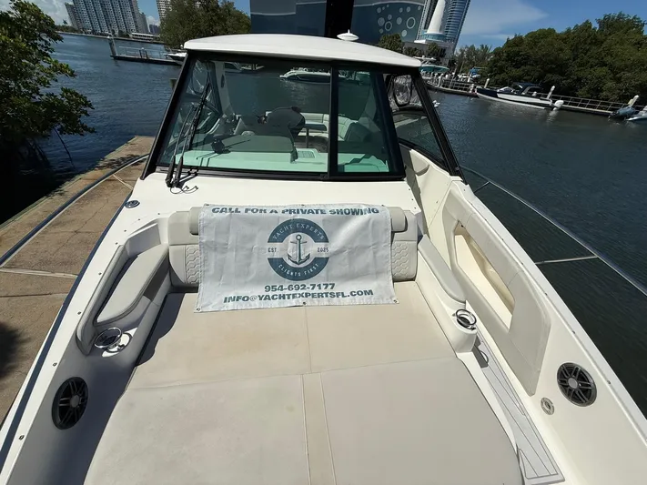  Yacht Photos Pics 2022 Sea Ray Sundancer 320 Outboard docked, featuring spacious seating and promotional banner.