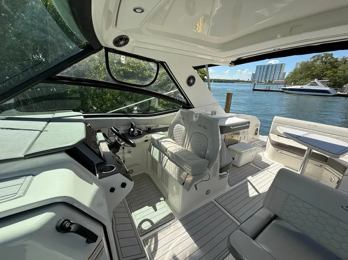  Yacht Photos Pics Interior of 2022 Sea Ray Sundancer 320 Outboard, featuring luxurious seating and modern design.