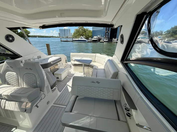  Yacht Photos Pics 2022 Sea Ray Sundancer 320 Outboard interior with luxurious seating and waterfront view.