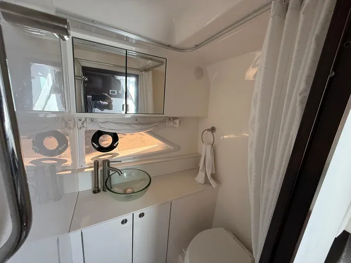  Yacht Photos Pics 2022 Sea Ray Sundancer 320 Outboard bathroom with modern fixtures and glass sink.