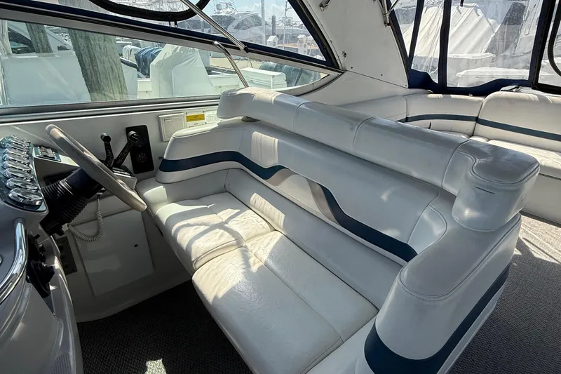  Yacht Photos Pics Interior of a 1999 Formula 400 Super Sport boat with white leather seating.