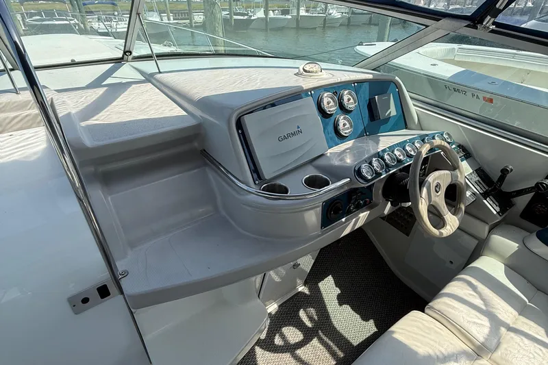  Yacht Photos Pics 1999 Formula 400 Super Sport boat dashboard with Garmin navigation system and steering wheel.