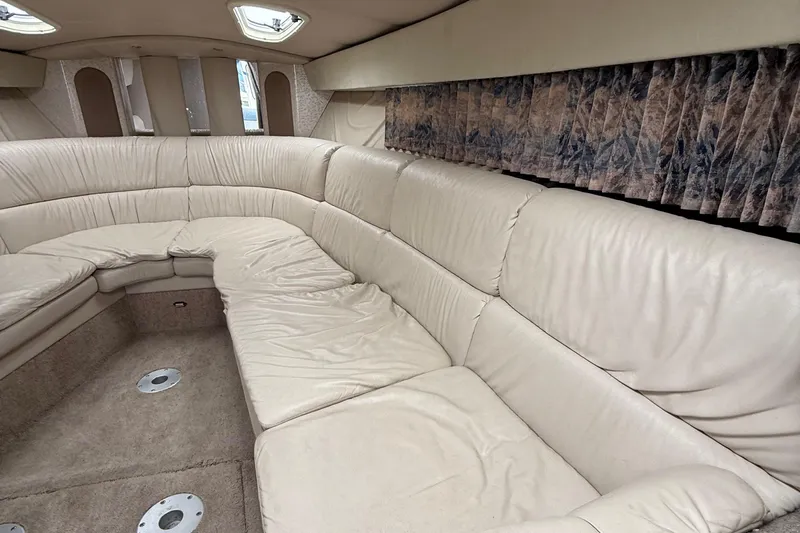  Yacht Photos Pics Interior of a 1999 Formula 400 Super Sport boat with beige leather seating.
