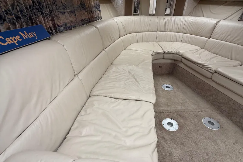  Yacht Photos Pics 1999 Formula 400 Super Sport interior with beige leather seating and carpeted flooring.