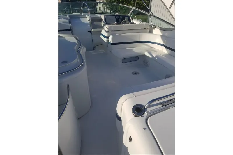  Yacht Photos Pics 1999 Formula 400 Super Sport boat interior with white seating and control panel.