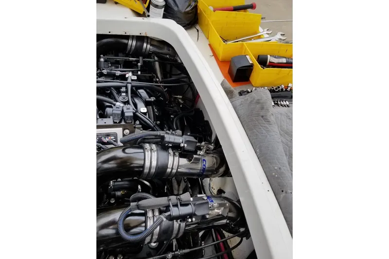  Yacht Photos Pics Engine compartment of a 1999 Formula 400 Super Sport with tools and parts nearby.