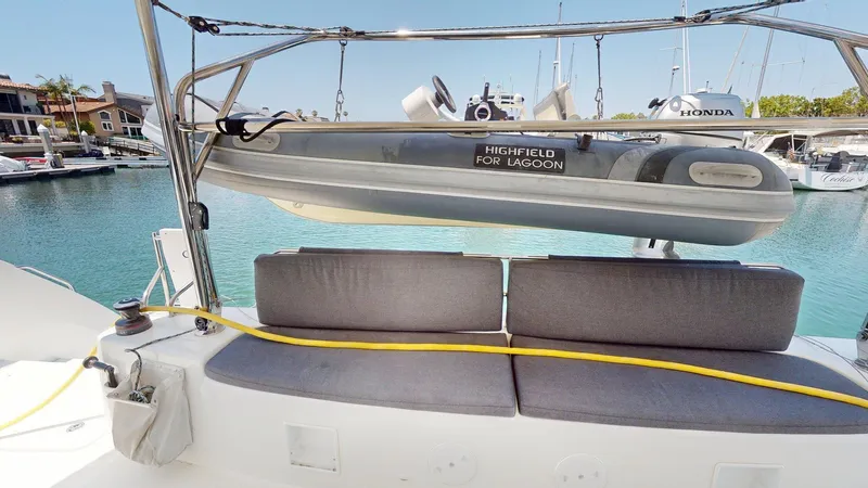 Sliver Fern Yacht Photos Pics Catamaran Lagoon 46 (2020) with Highfield tender, docked in a marina.