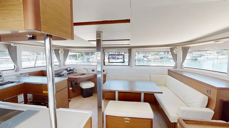 Sliver Fern Yacht Photos Pics Interior of 2020 Lagoon 46 catamaran with modern kitchen and dining area.