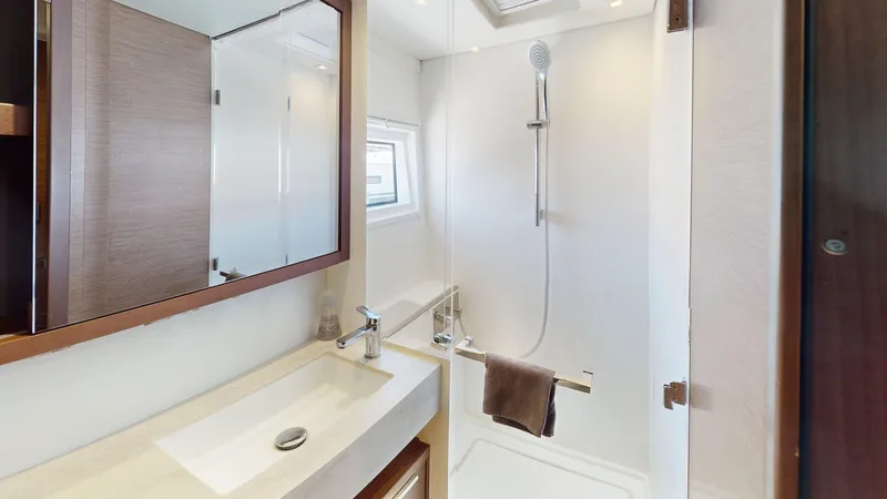 Sliver Fern Yacht Photos Pics Modern bathroom in 2020 Lagoon 46 yacht with shower and sleek vanity.