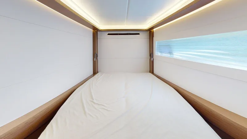 Sliver Fern Yacht Photos Pics Luxurious cabin interior of 2020 Lagoon 46 yacht with modern lighting and window view.